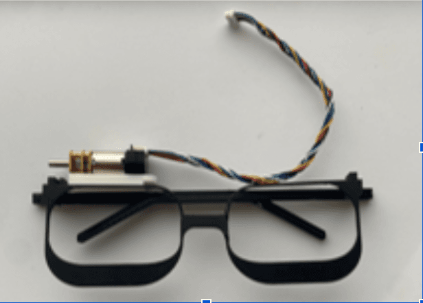 Assistive glasses with a small motor mounted above the frame